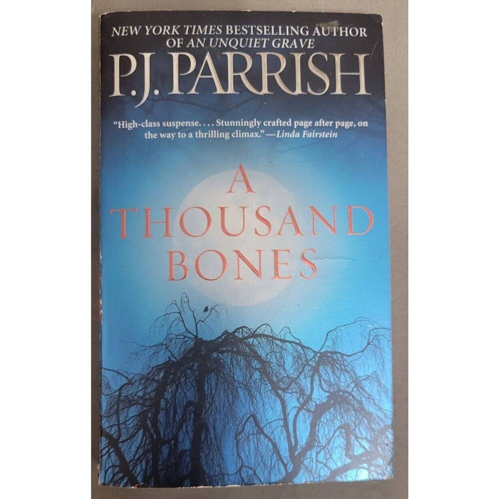 A Thousand Bones P.J. Parrish Book Paperback